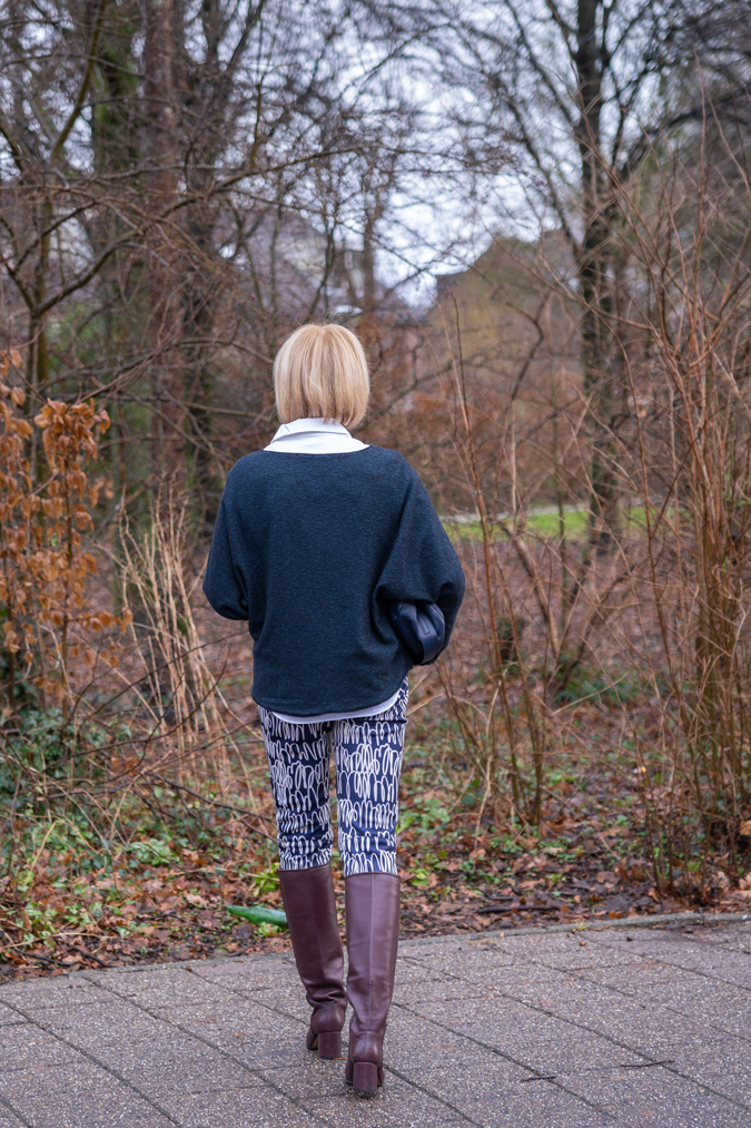 Patterned trousers and burgundy boots