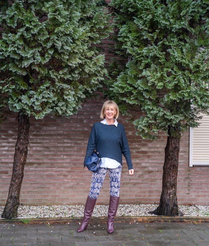 Patterned trousers and burgundy boots