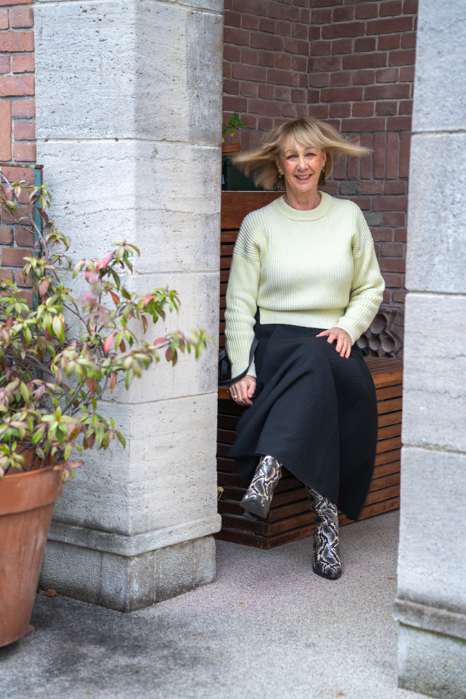 Wide black skirt with pale yellow jumper