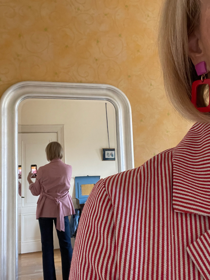 Red and white striped jacket on jeans with pink and red earring from Lara Design