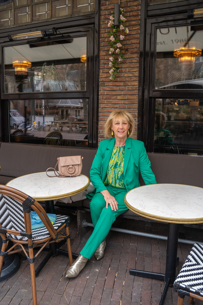 Green suit with green yellow blouse