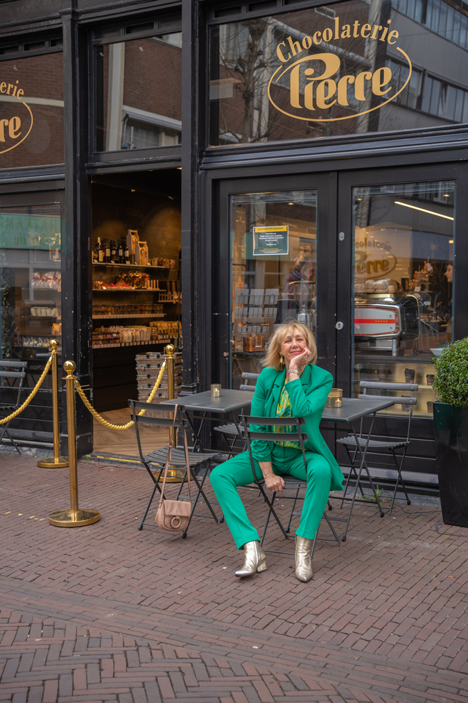 Green suit with green yellow blouse