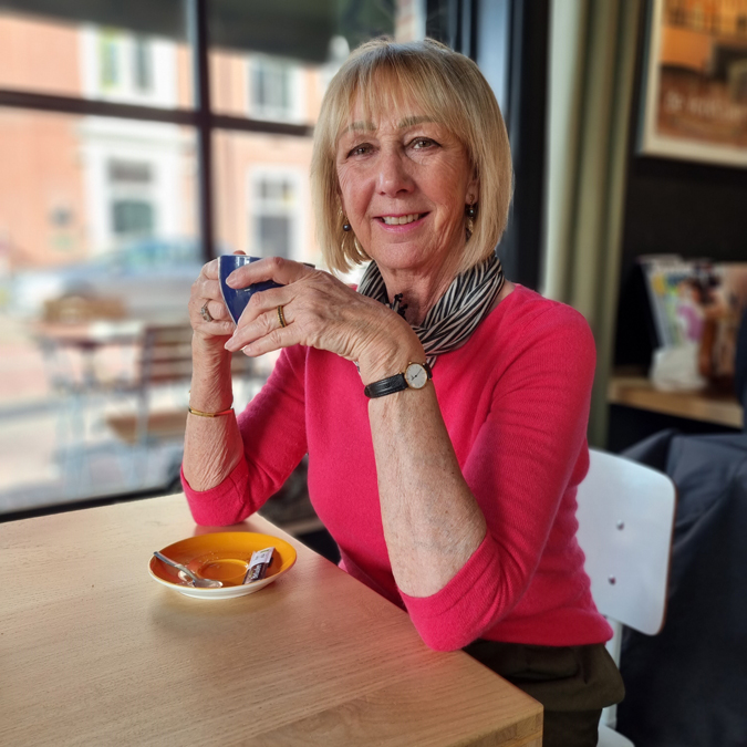 Olive coloured trousers with a bright pink jumper