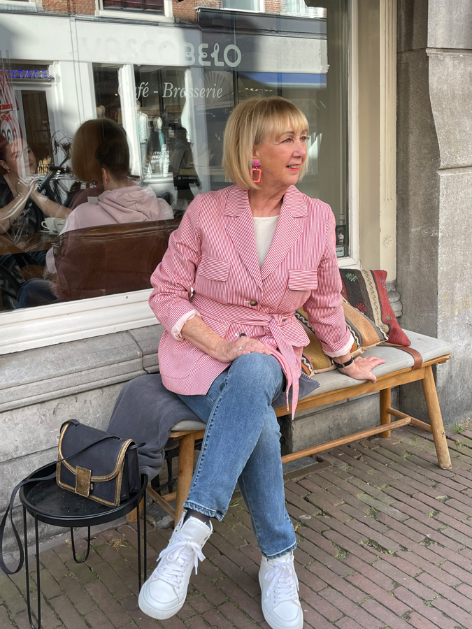 Red and white striped jacket on jeans