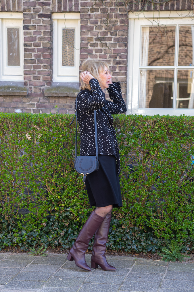 Black and white blazer with a black skirt
