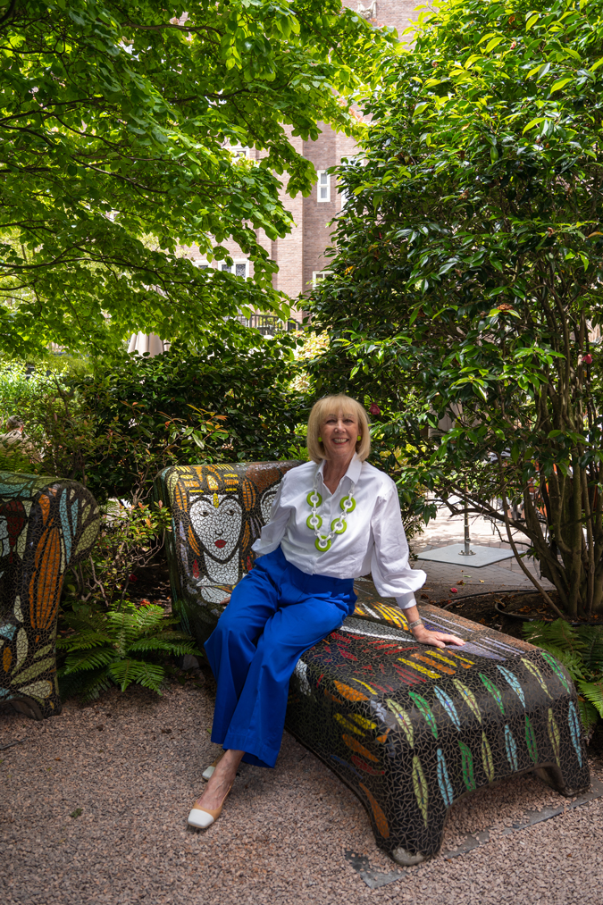 Cobalt blue trousers with green and white necklace by Angela Caputi