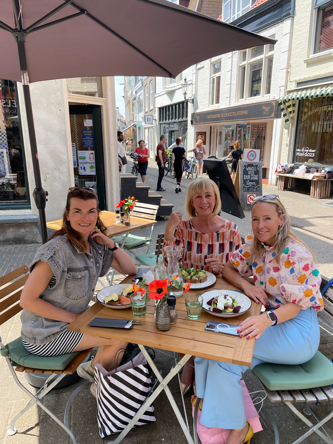 Multi coloured top with cognac coloured trousers. With Anke and Sabine.