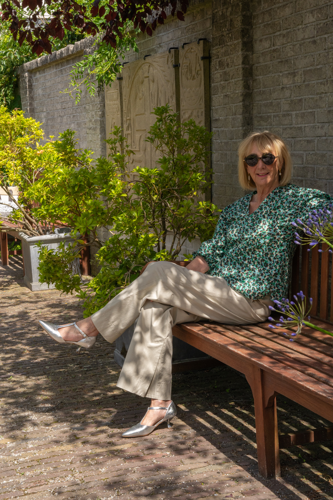 Pebble coloured trousers with a peplum top