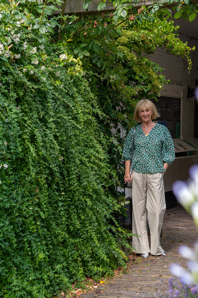Pebble coloured trousers with a peplum top