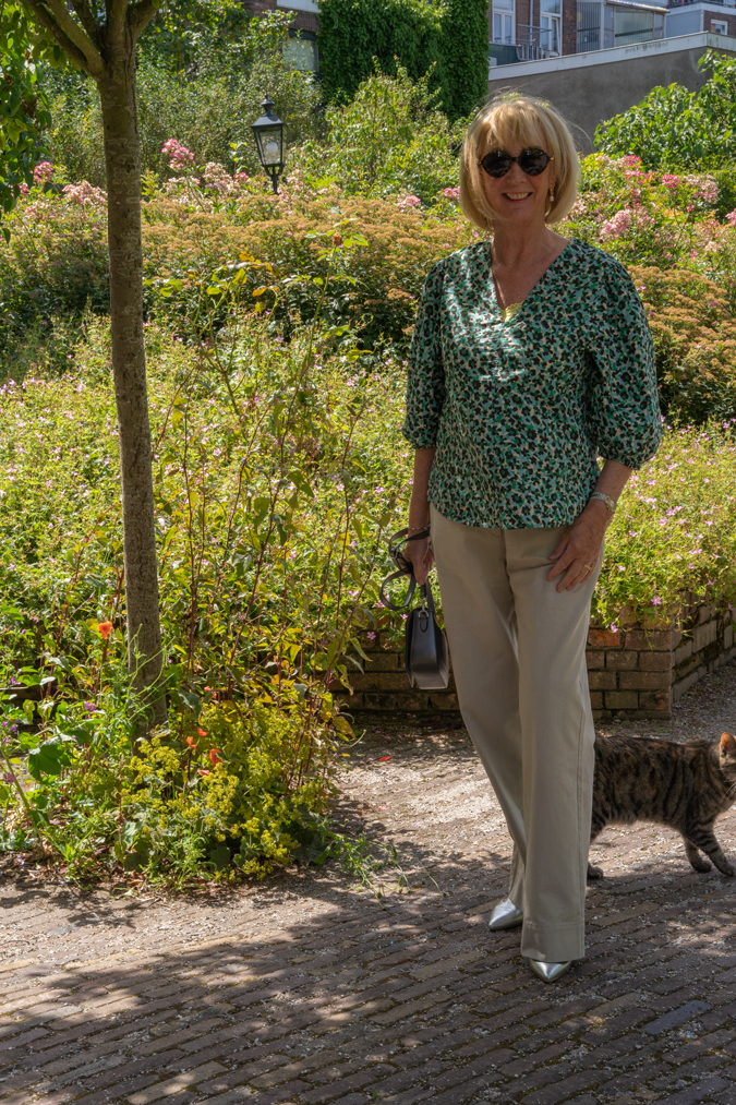 Pebble coloured trousers with a peplum top