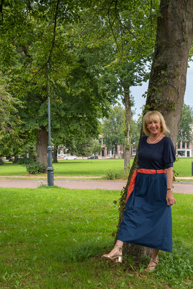 Blue monochrome outfit with an orange scarf