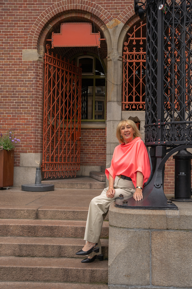 pebble coloured trousers with a neon pink top