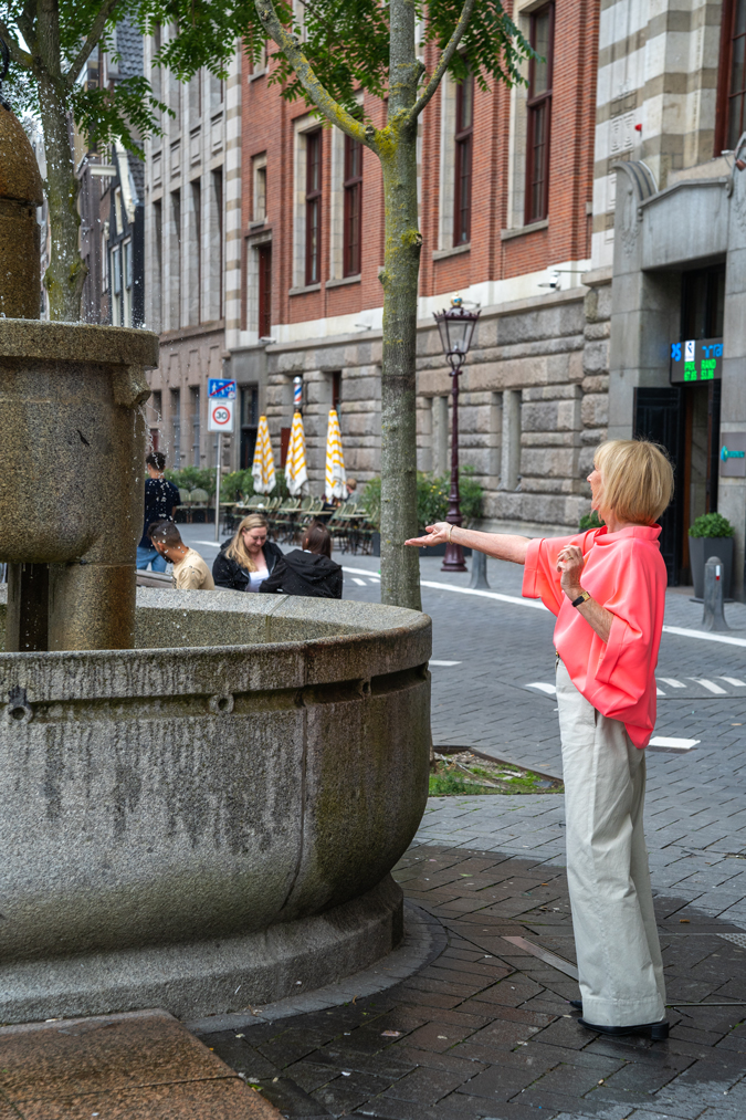 pebble coloured trousers with a neon pink top