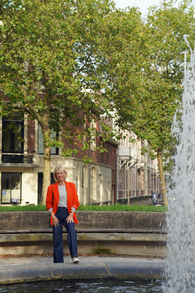 Wide leg jeans with an oversized orange blazer