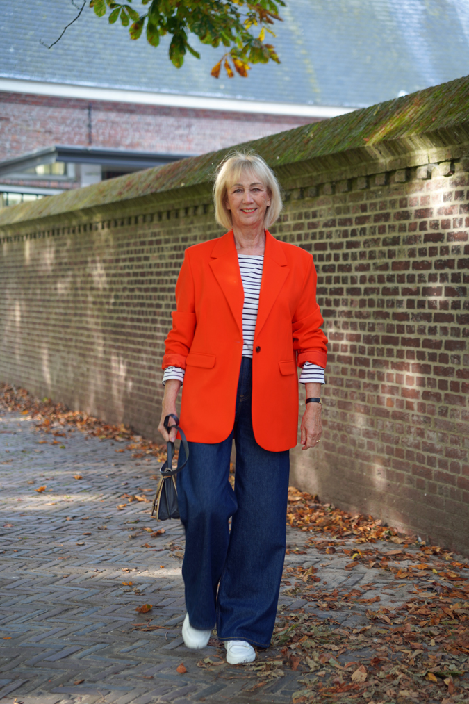 Wide leg jeans with an oversized orange blazer