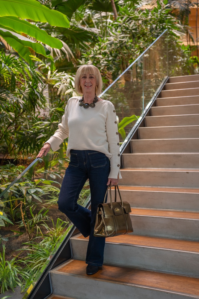 Flared jeans with a cream jumper