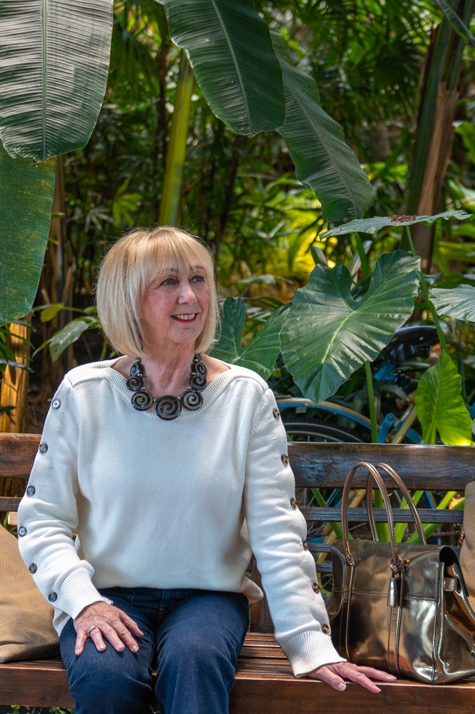 Flared jeans with a cream jumper