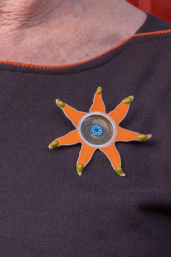 Orange brooch