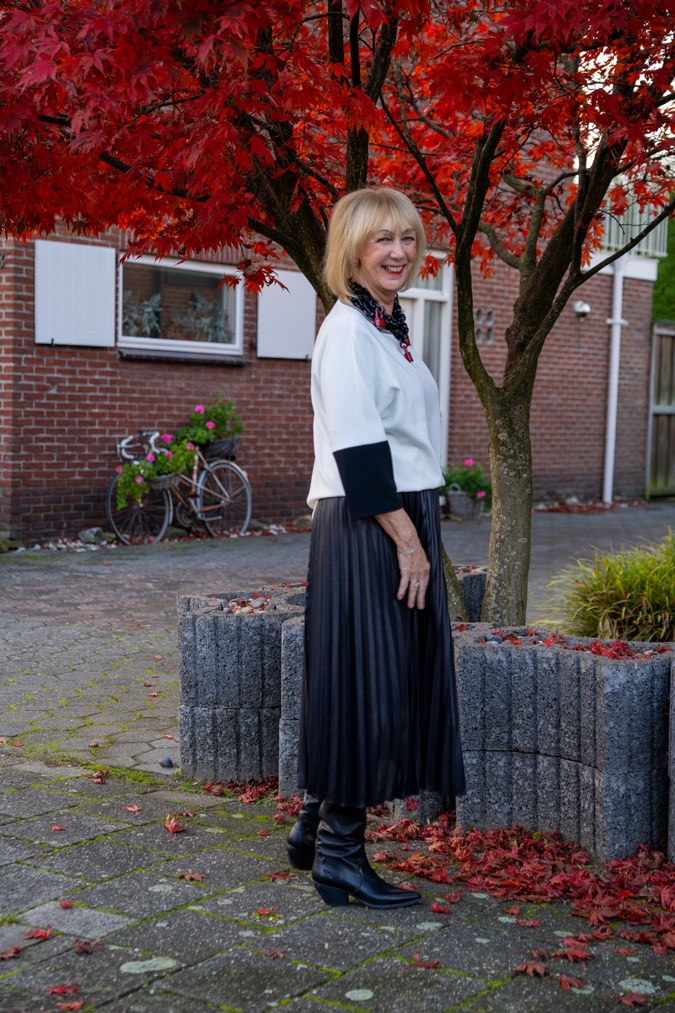Pleated skirt and the Angela Caputi padlock necklace