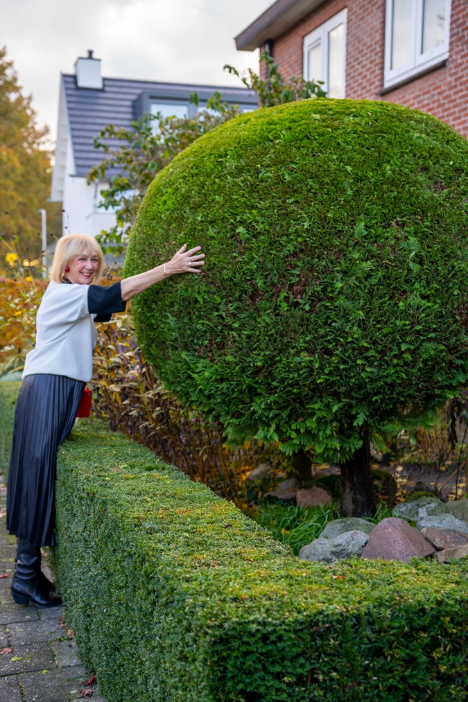 Pleated skirt and the Angela Caputi padlock necklace