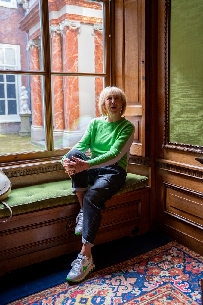 Man repeller jeans with a green and blue jumper