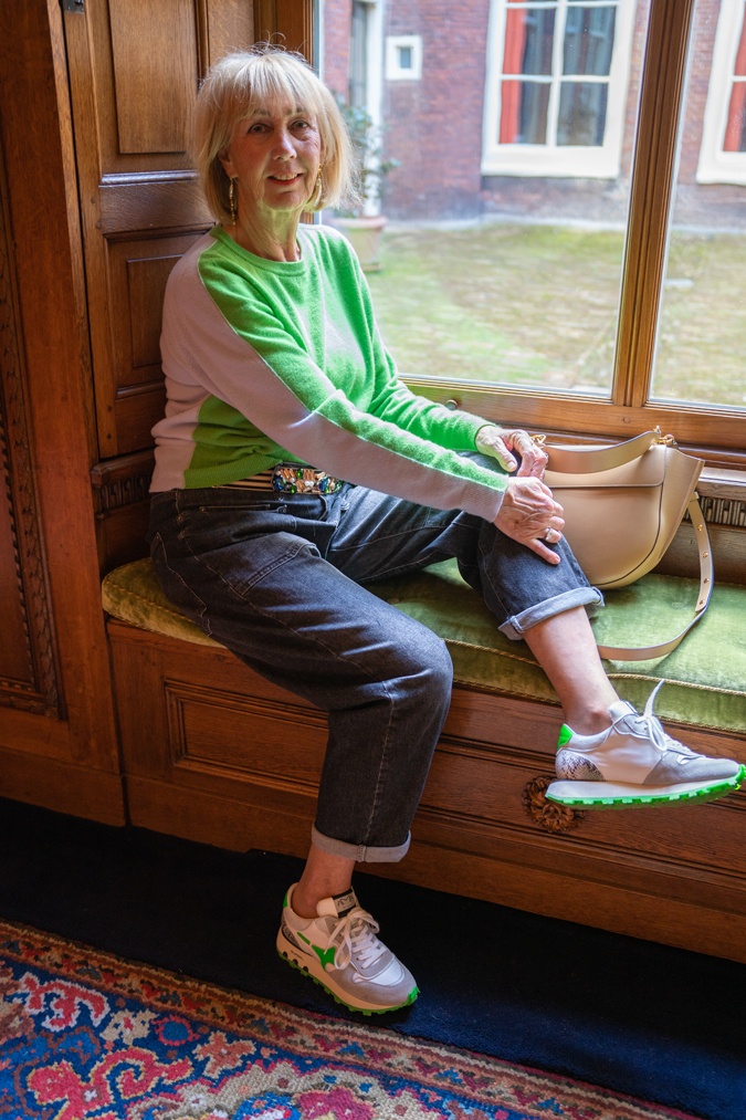 Man repeller jeans with a green and blue jumper