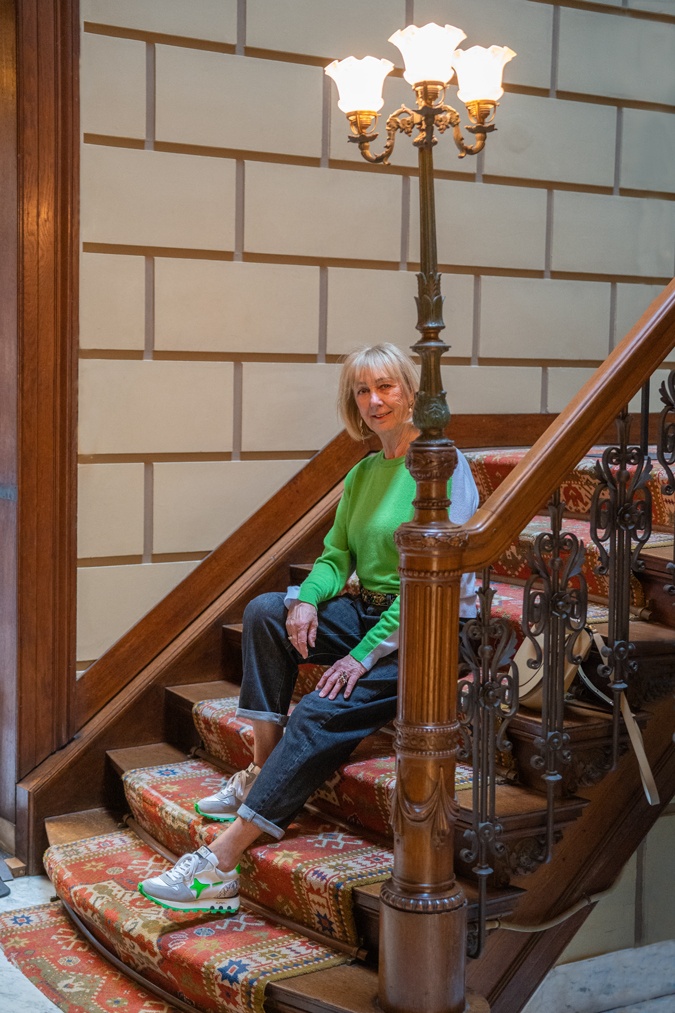 Man repeller jeans with a green and blue jumper