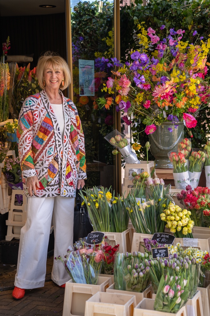 Multicoloured jacket with white wide leg trousers