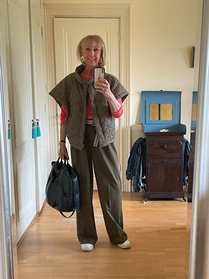 Olive coloured trousers with a pale blue blouse