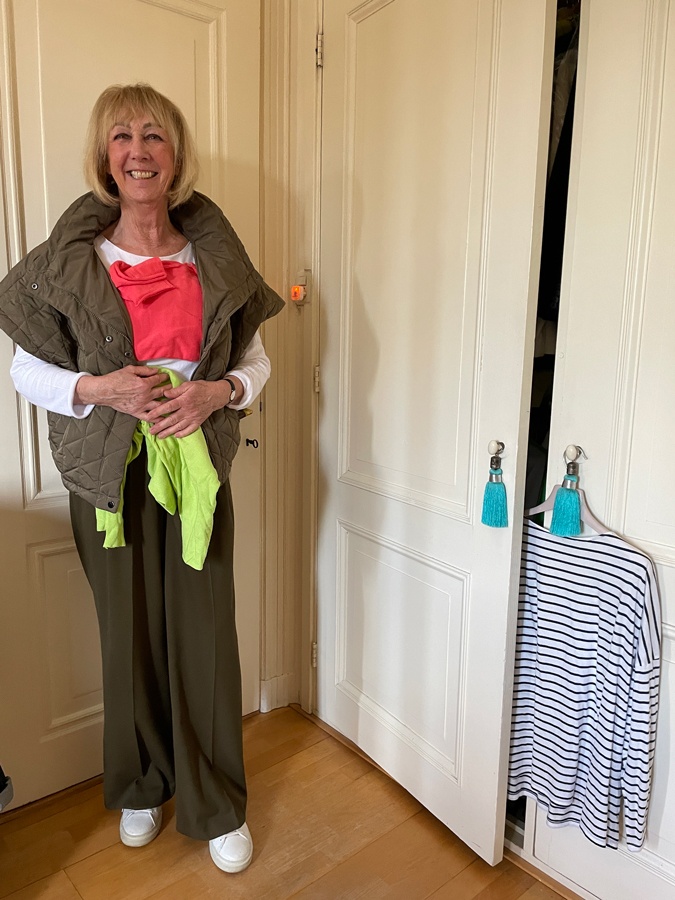 Olive coloured trousers with a pale blue blouse