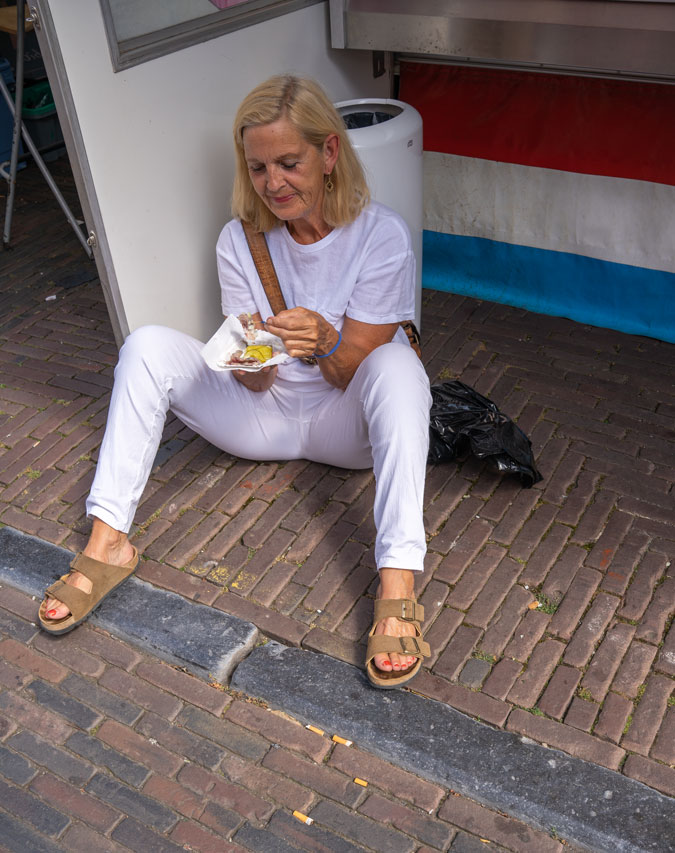 Woman eating a herring