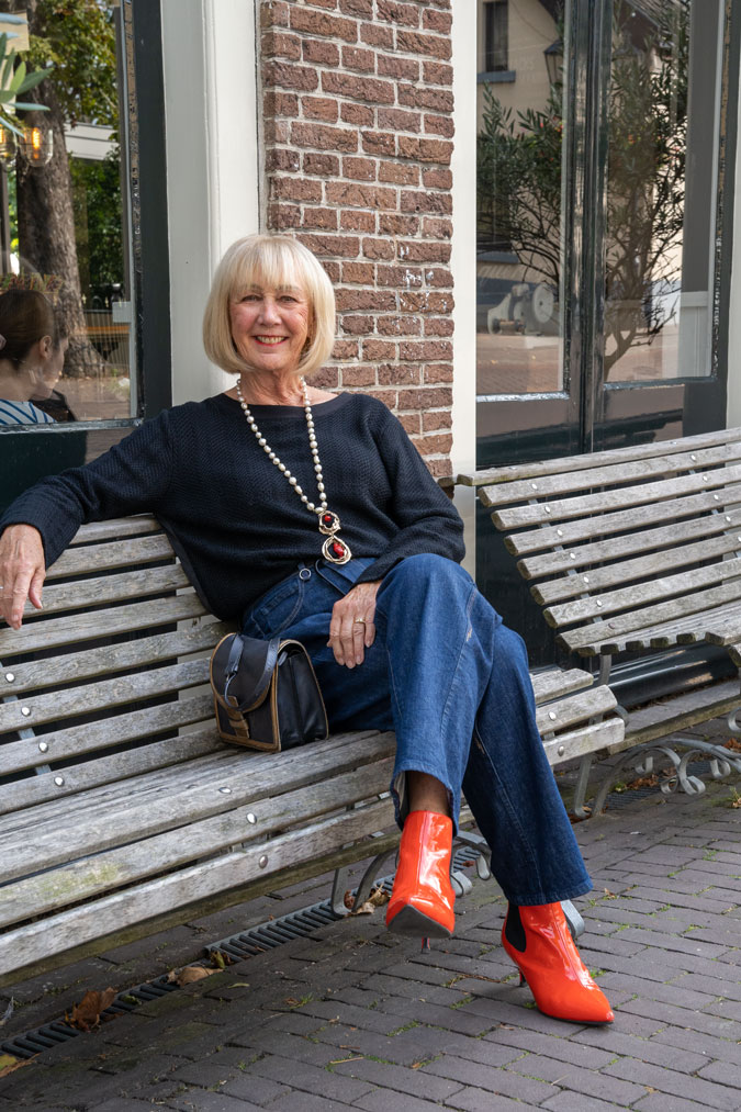 Baggy jeans with a black jumper and orange boots