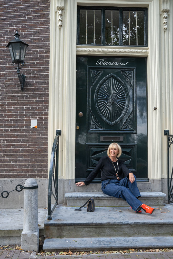 Baggy jeans with a black jumper and orange boots