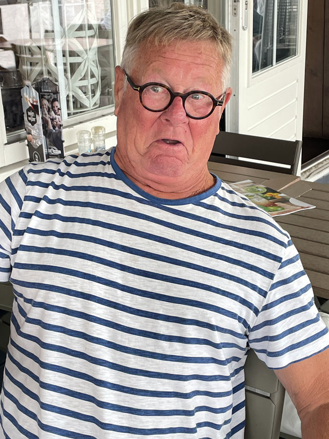 Husband Ron holding his belly