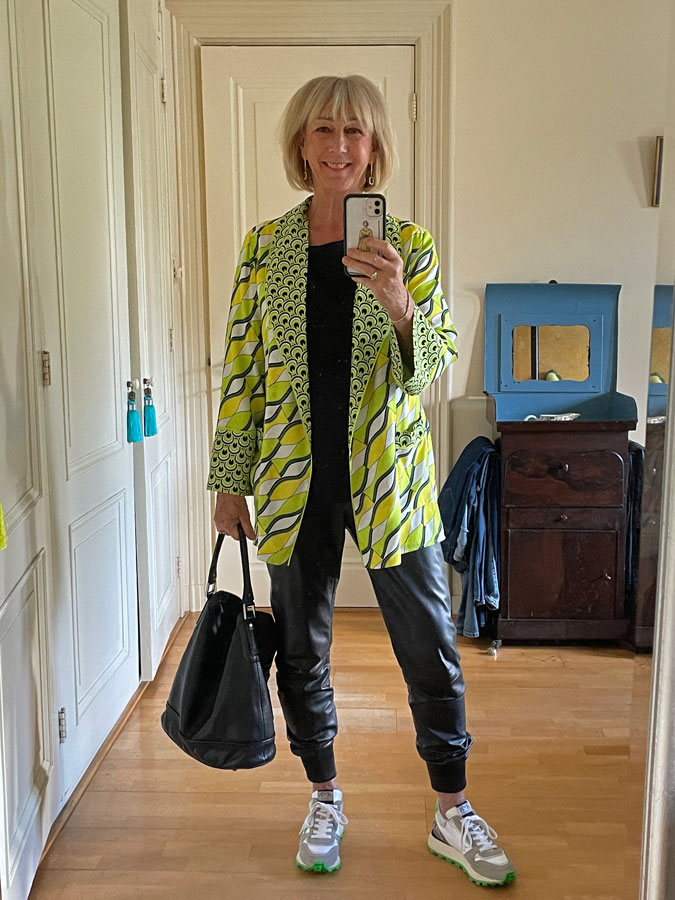 Leather jogging trousers with a lime coloured patterned jacket