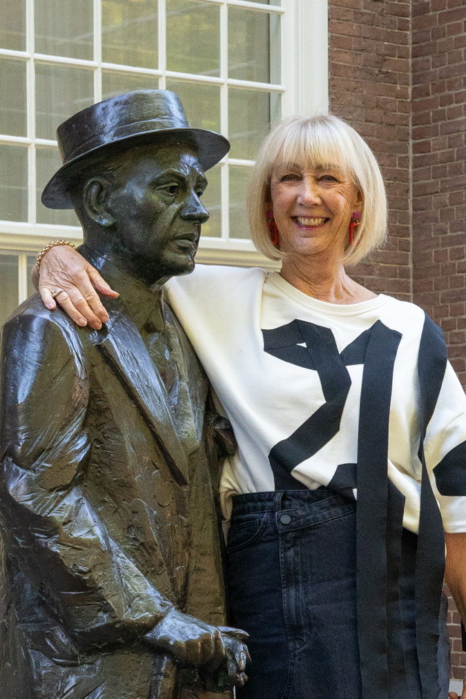 Long denim skirt and red with pink earrings