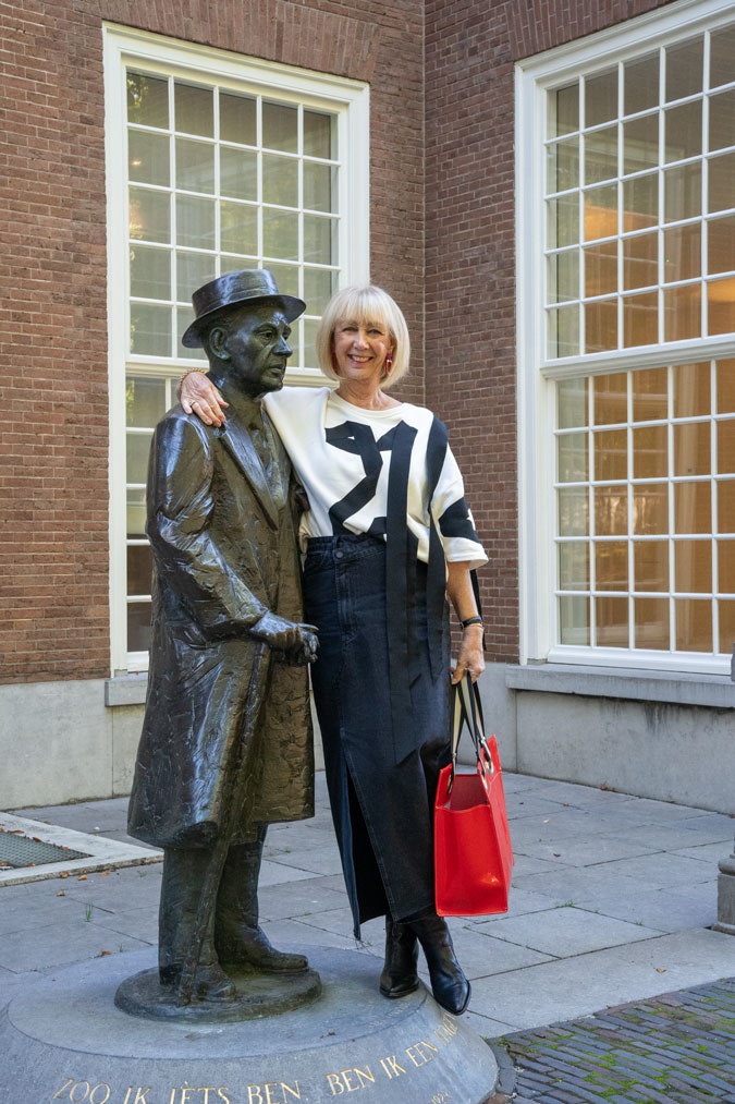 Long denim skirt with red accessories