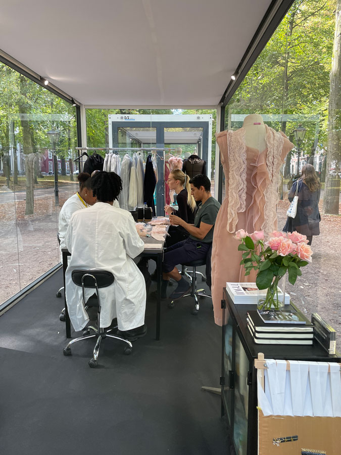 tailors working on the fashion creations of