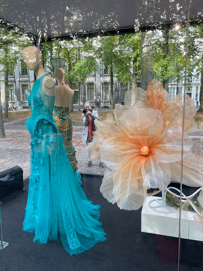 Marjolein taking a photograph of the fashion exhibition