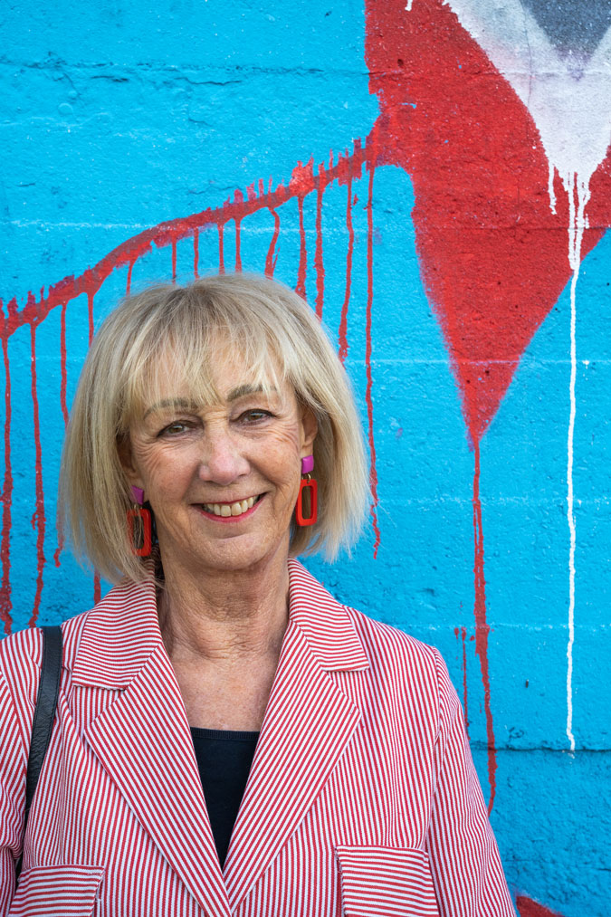 Close-up of red and pink earrings by Lara Design