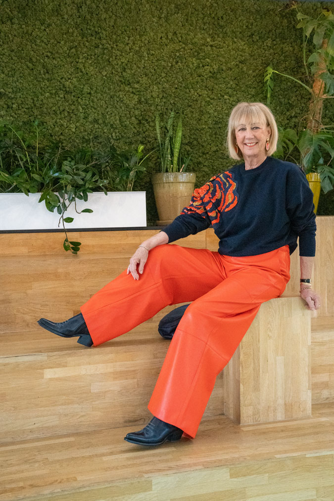 Orange pleather trousers and sequinned sweater