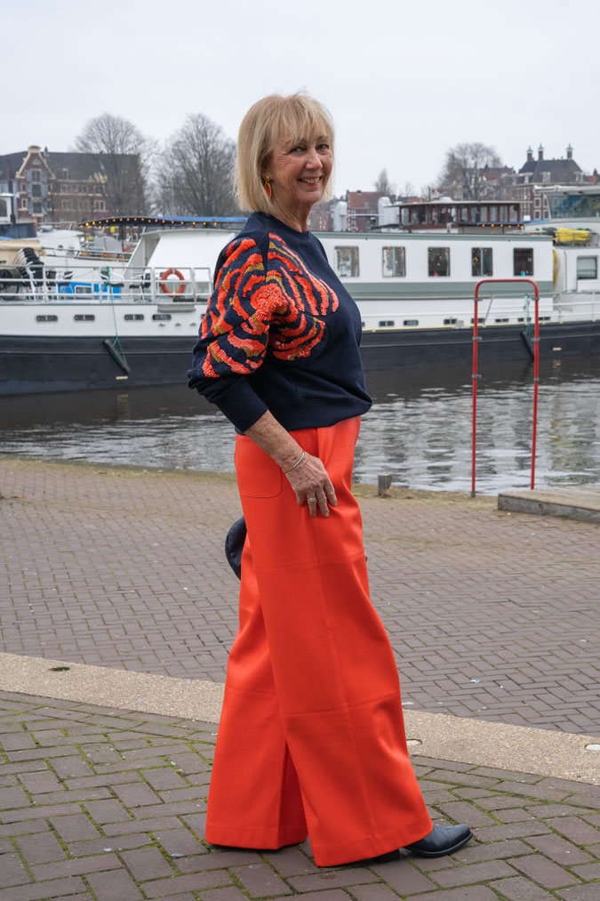 Orange pleather trousers and sequinned sweater