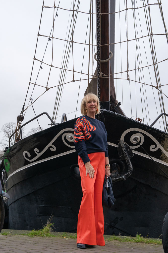 Orange pleather trousers and sequinned sweater