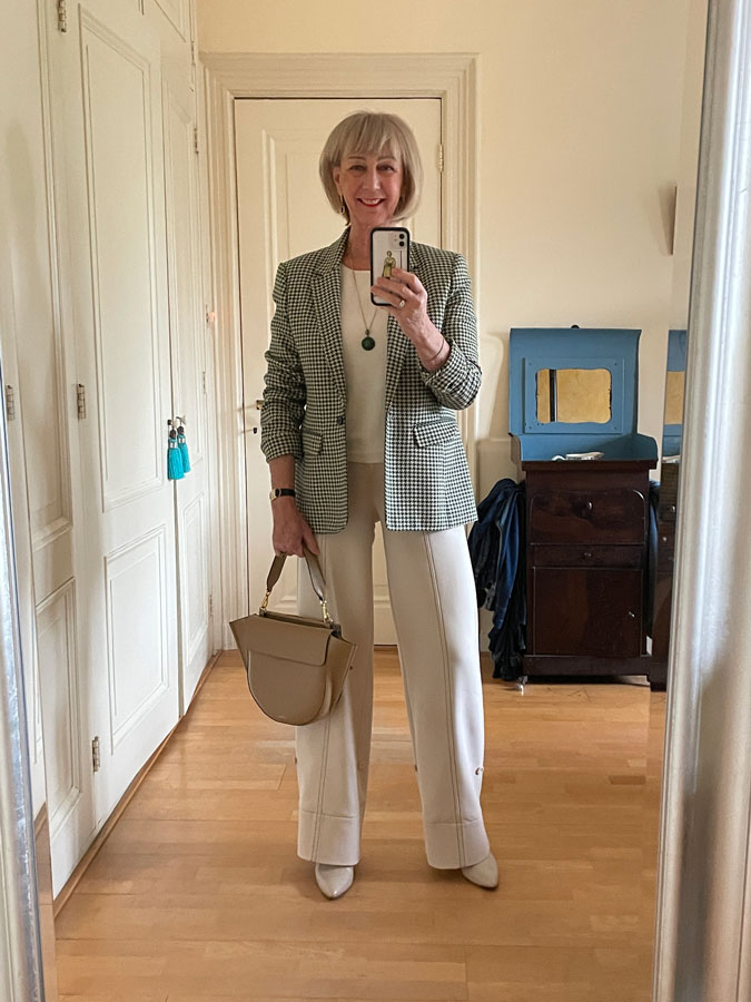 Houndstooth blazer and cream trousers