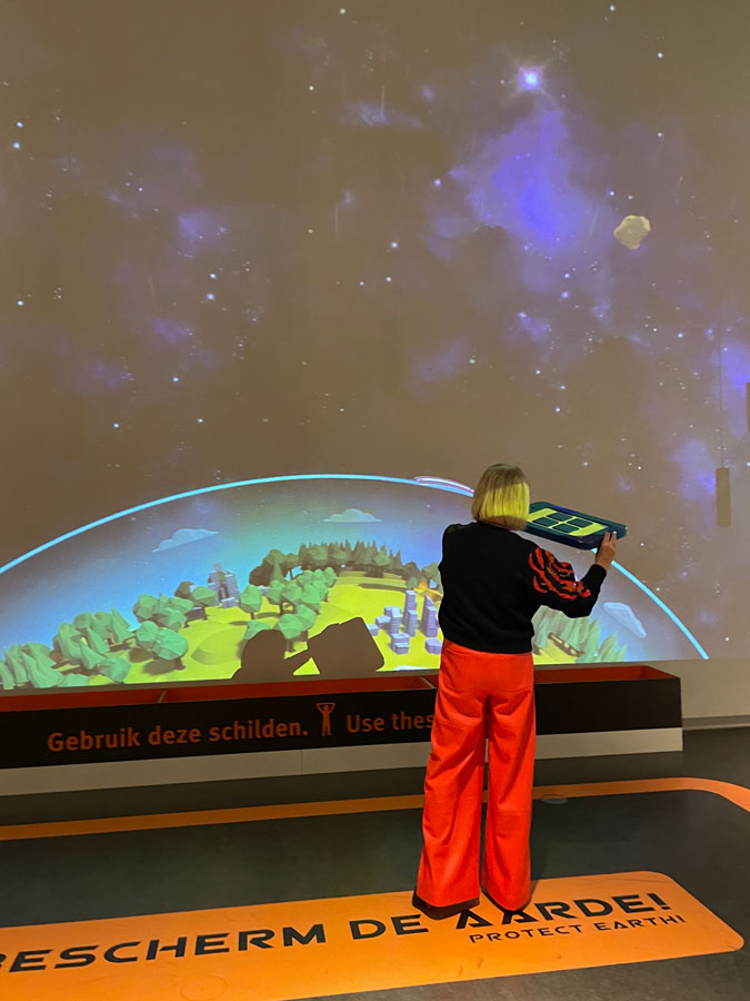 Orange pleather trousers and sequinned sweater