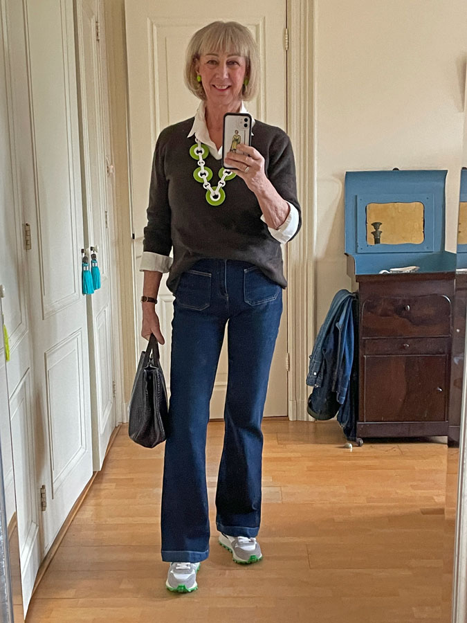 Jeans with a brown jumper and a statement necklace