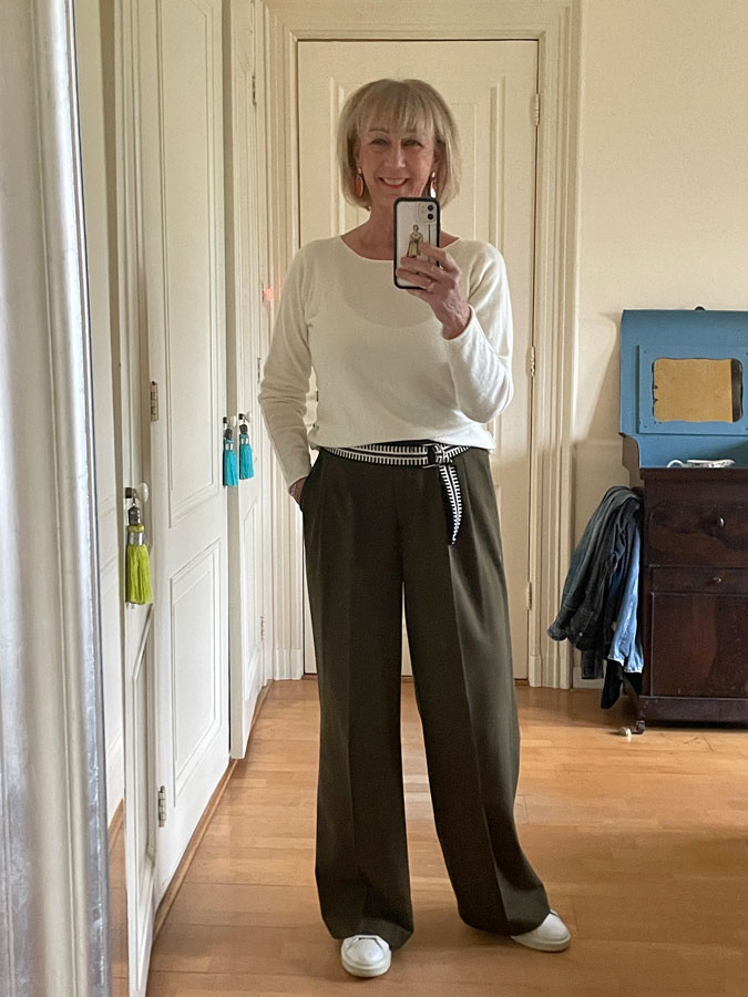 wide leg olive coloured trousers with a cream top