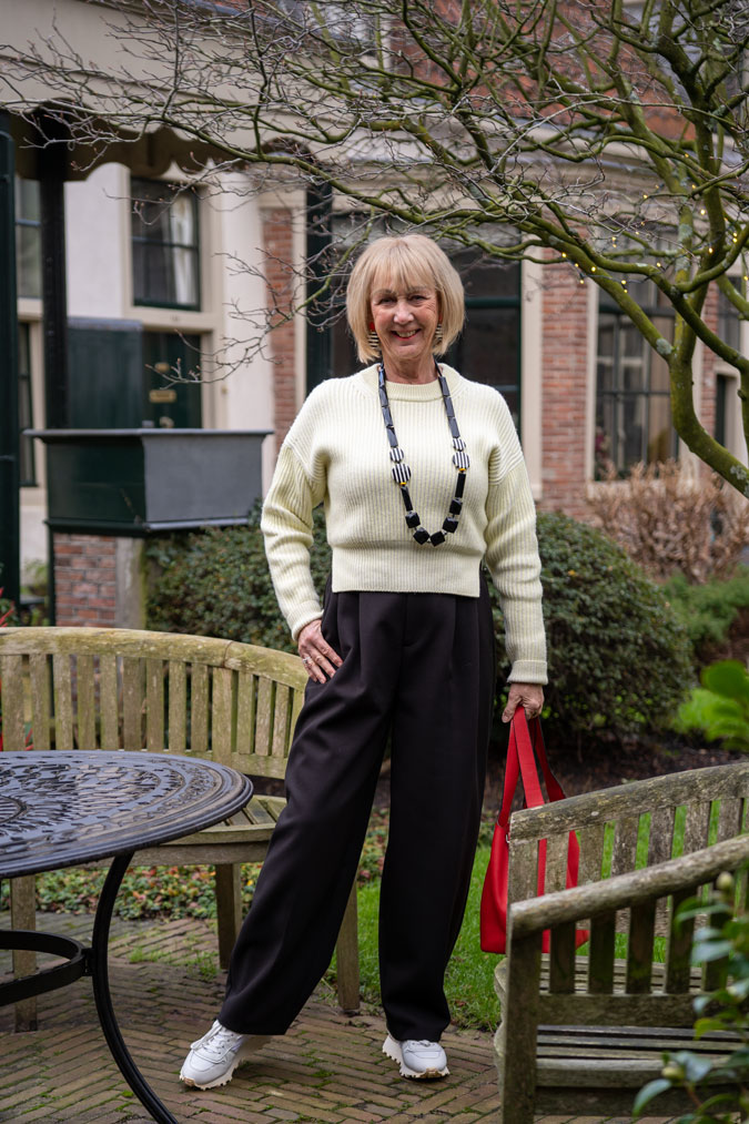 Wide black trousers with the soft yellow jumper