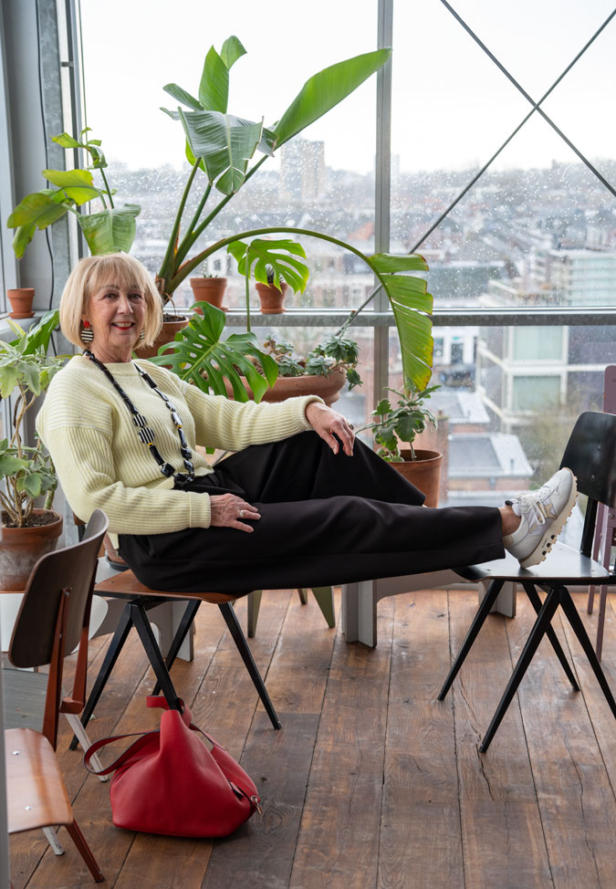 Wide black trousers with the soft yellow jumper