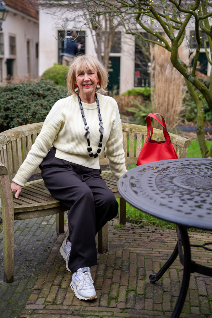 Wide black trousers with the soft yellow jumper